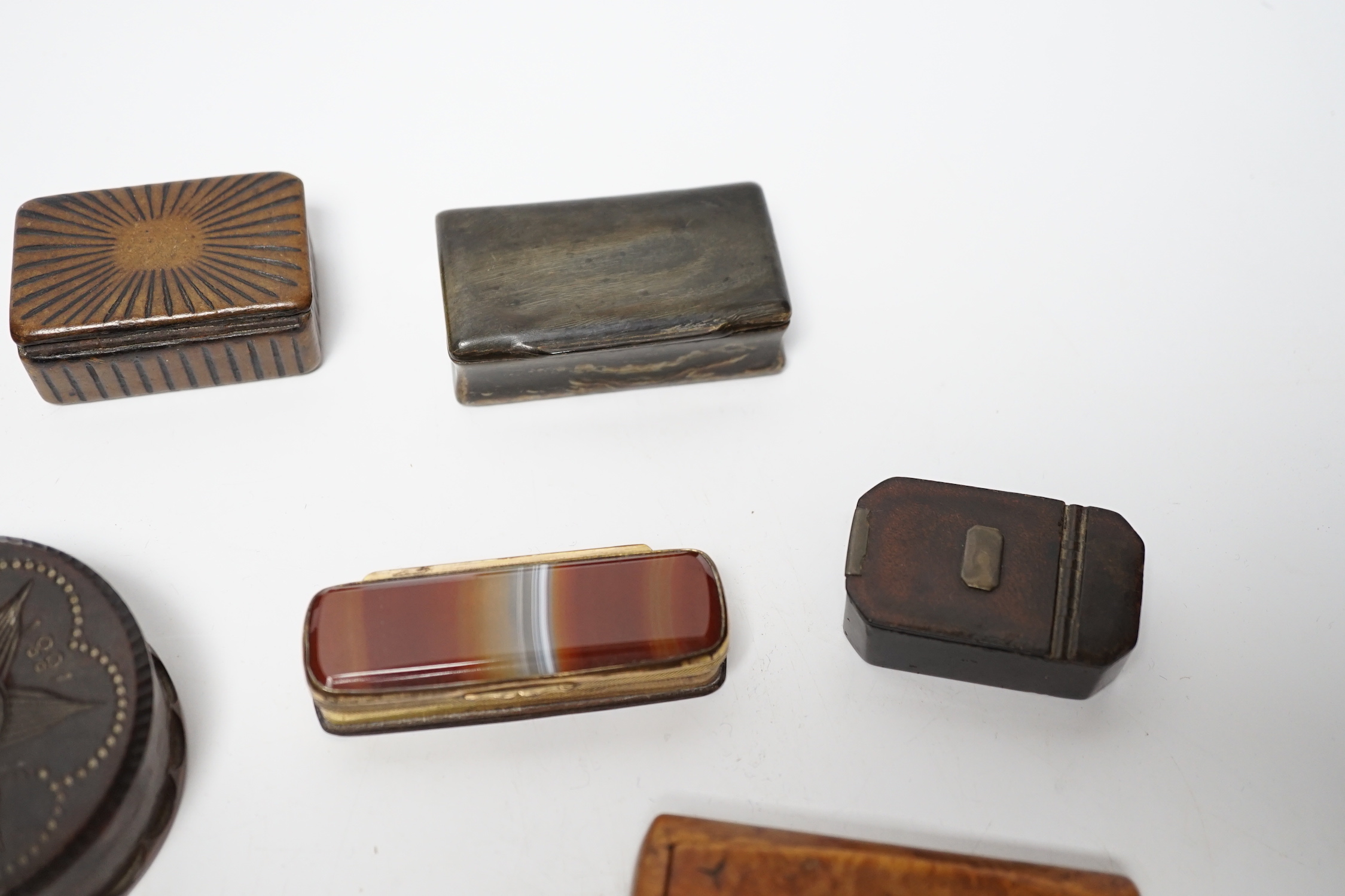 A collection of ten snuff boxes in tortoiseshell, treen or horn, etc.